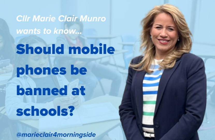 Children are at school with mobile phones in their hand inside the classroom.